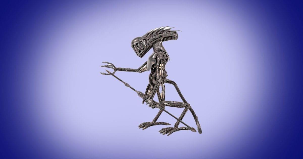 Handcrafted metal Xenomorph alien sculpture in antique silver finish science fiction collectible statue.