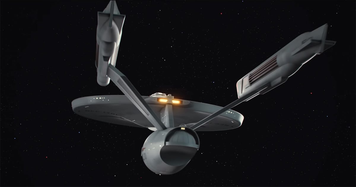 The refit USS Enterprise shown in a slow exterior flyby in Star Trek The Motion Picture, emphasizing size and visual scale.