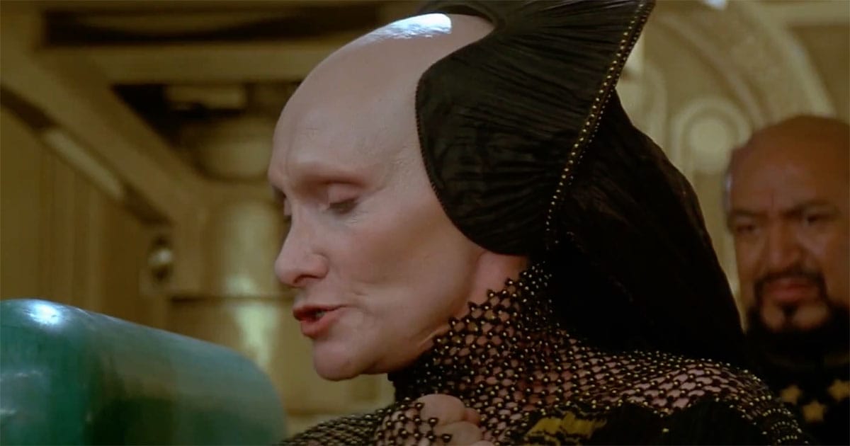 Reverend Mother Gaius Helen Mohiam in Dune 1984 shown in profile, wearing Bene Gesserit robes with a composed, restrained expression.