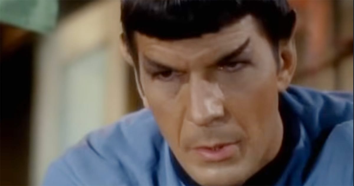 Close-up of Spock leaning forward in concentration, his expression focused and controlled, illustrating restraint in Star Trek.
