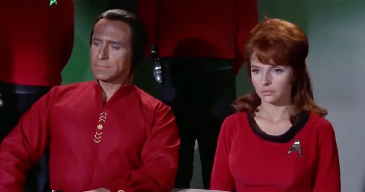 Khan Noonien Singh seated calmly beside a Starfleet officer in Star Trek The Original Series Space Seed scene