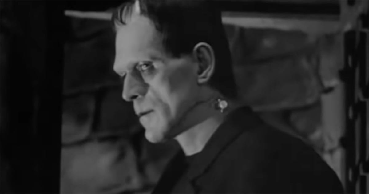 Profile close-up of the creature in the 1931 film Frankenstein, shown in a quiet, reflective moment without action.