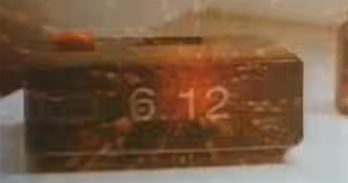 Digital clock showing 6:12 in The Quiet Earth marking the moment of the Effect.