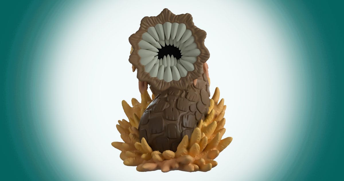 Dune sandworm vinyl figure emerging from desert sand Youtooz collectible statue.