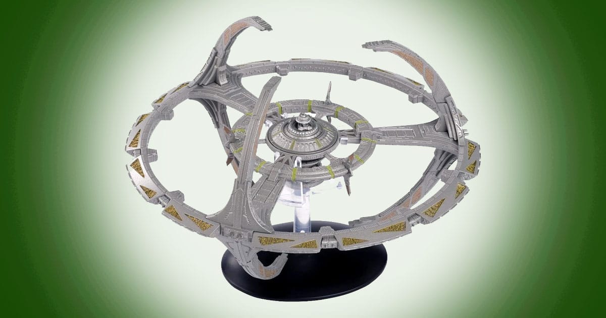 Detailed model of Deep Space 9 from Star Trek showing circular ring structure with central core and docking arms mounted on a display stand.