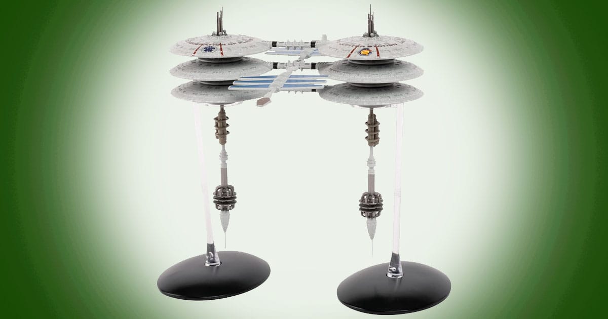 Model of Jupiter Station from Star Trek featuring stacked saucer sections connected by central framework and support structures mounted on display stands.