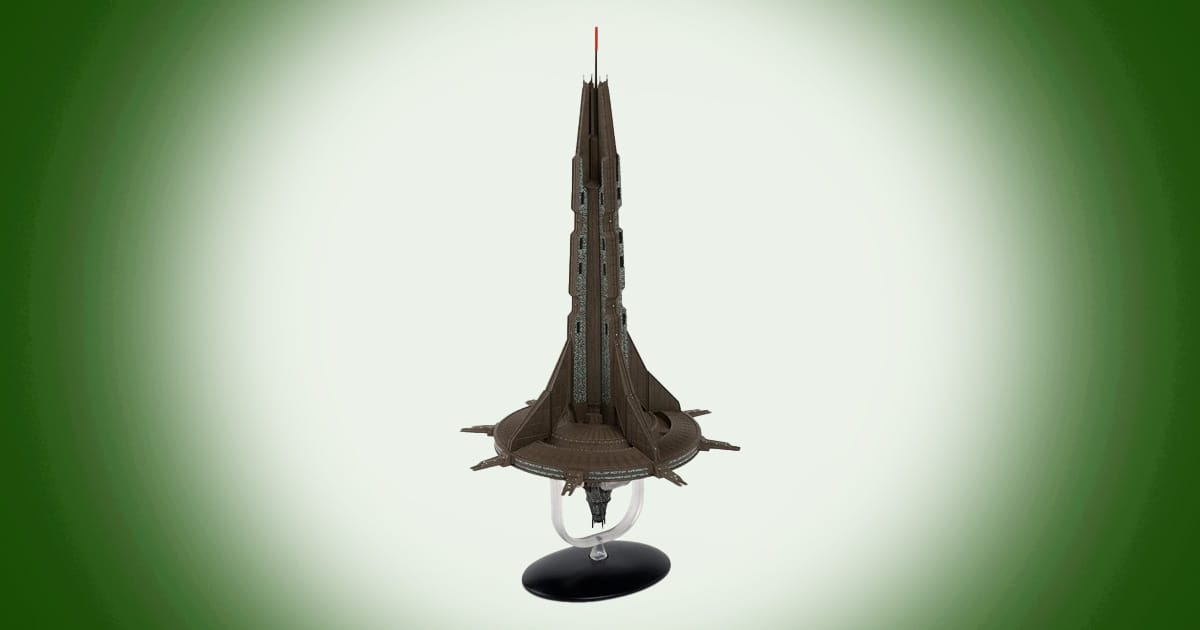 Model of Starbase 1 from Star Trek Discovery showing tall central spire and circular base structure mounted on a display stand.