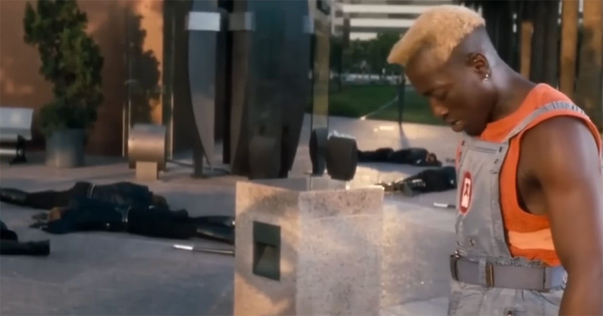 Simon Phoenix stands in peaceful San Angeles after violent confrontation in Demolition Man 1993.