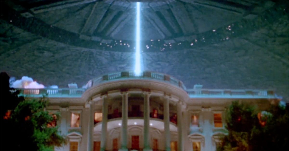 Alien spacecraft firing a massive energy beam at the White House during the invasion in "Independence Day".