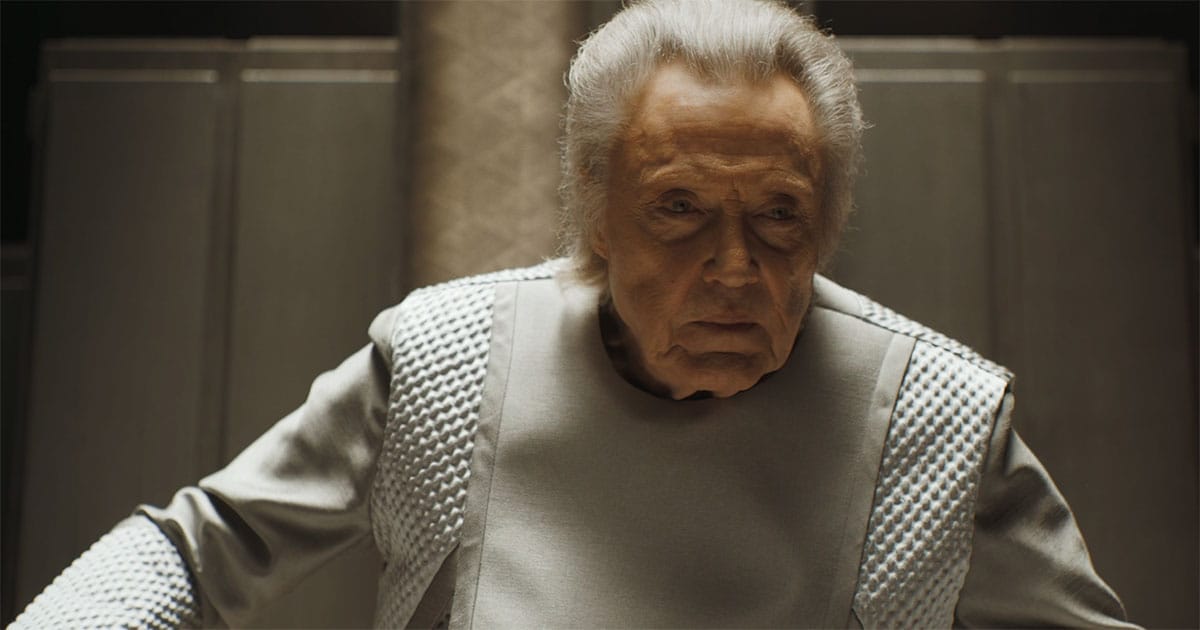 Emperor Shaddam IV seated in the imperial chamber during the final days of House Corrino rule in "Dune Part Two."