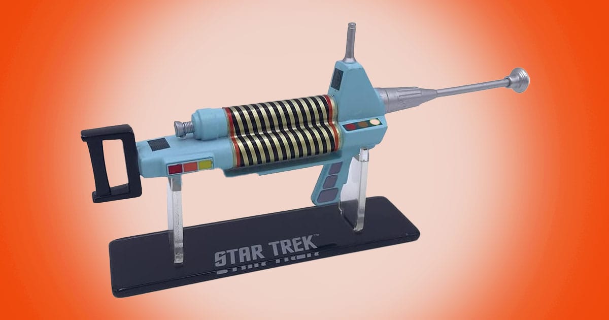 Star Trek The Original Series phaser rifle prop replica displayed on stand with classic retro sci fi design.