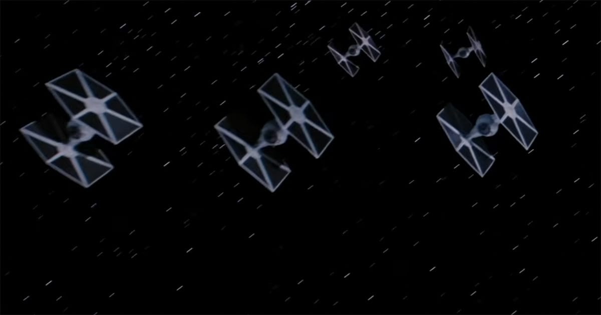 Formation of Imperial TIE fighters flying through space in "Star Wars."