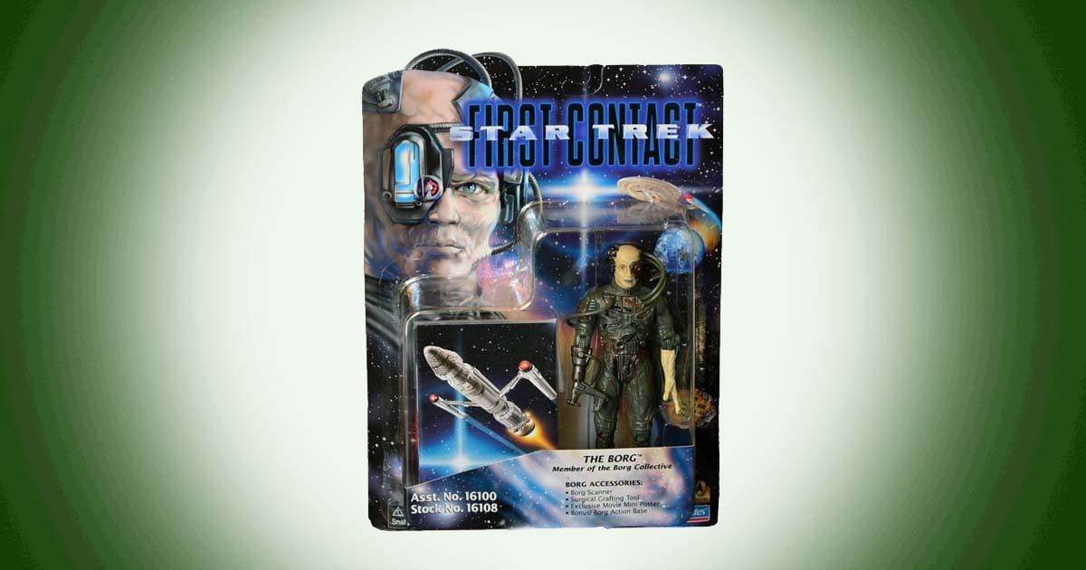 Star Trek First Contact Borg action figure in original packaging with accessories and space background card.
