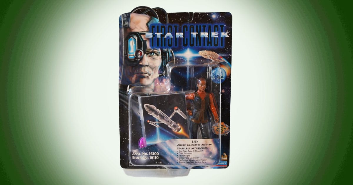 Star Trek First Contact Lily action figure in original packaging with Phoenix ship image and accessories.