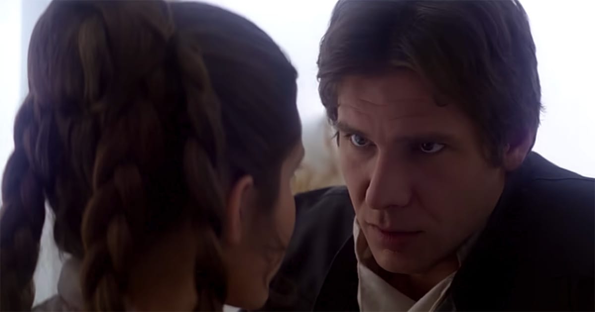 Han Solo looks intently at Leia aboard the Millennium Falcon, showing calm determination amid rising danger.