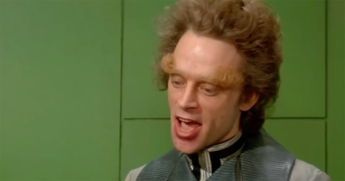 Brad Dourif as Piter de Vries in “Dune” (1984), framed against the green walls of Giedi Prime, face alive with manic thought.
