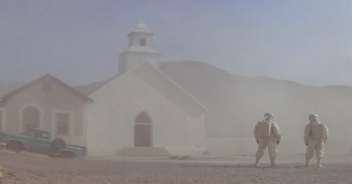 Scientists in protective suits investigate a deserted desert town after a mysterious biological event in the film "The Andromeda Strain" (1971).