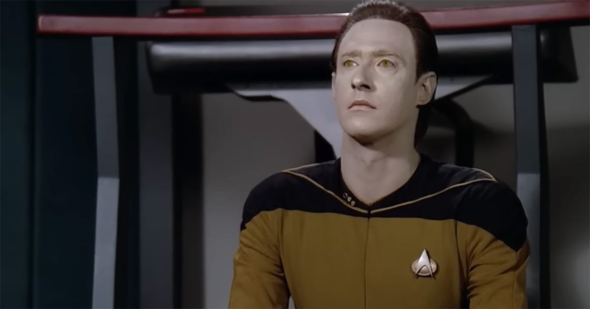 Data seated in contemplation in Star Trek The Next Generation