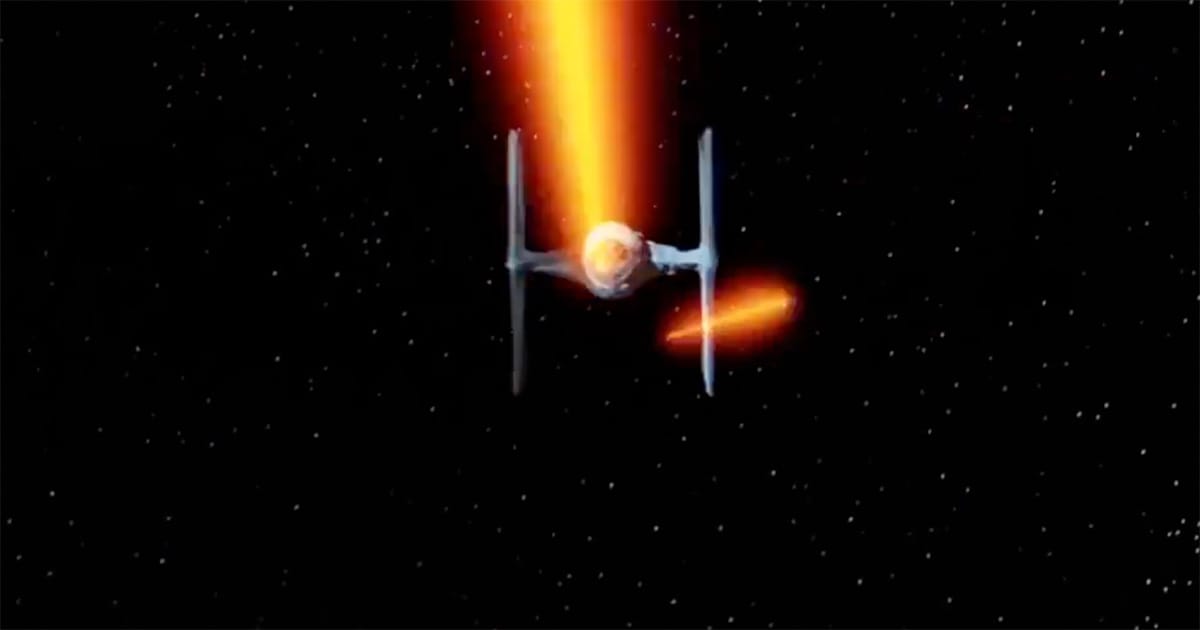 Front view of an Imperial TIE fighter firing lasers in space from "Star Wars."