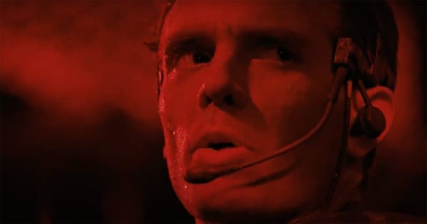 Michael Biehn as Hicks in red lighting, focused and prepared for battle. In the movie Aliens 1986.