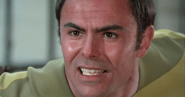 John Saxon dressed in futuristic attire as Dylan Hunt in the 1974 television film "Planet Earth"