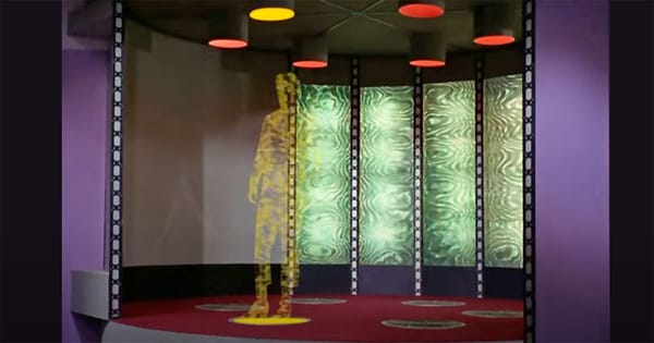 Classic "Star Trek" transporter sequence showing a crew member mid-dematerialization aboard the USS Enterprise.