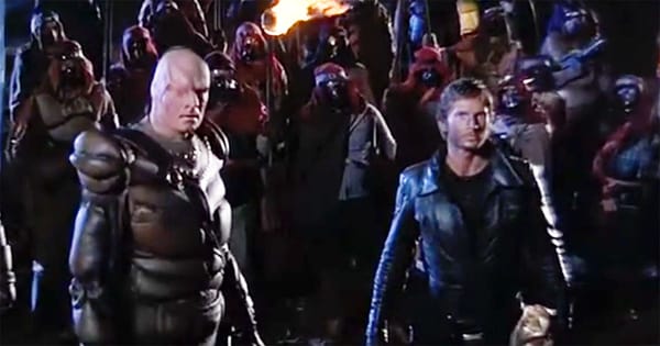 Scene from "Metalstorm The Destruction of Jared-Syn" showing Dogen, Rhodes, and the One Eyes tribe in a canyon at night