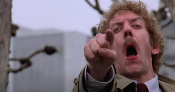 Donald Sutherland pointing and screaming in the final scene of the 1978 movie Invasion of the Body Snatchers, capturing paranoia and exposure of humanity’s last survivors.