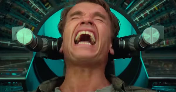 Total Recall 1990 scene showing Arnold Schwarzenegger as Douglas Quaid in Rekall memory chair exploring themes of reality and identity.