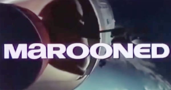 Title frame from the 1969 film “Marooned” showing a spacecraft orbiting Earth with bold white lettering across the image.