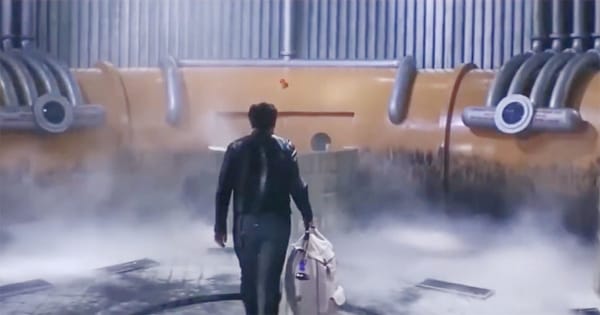 Kris Kelvin walks through the misty industrial corridor of the Solaris space station in Andrei Tarkovsky’s 1972 film, carrying his bag toward the mysterious living planet below.