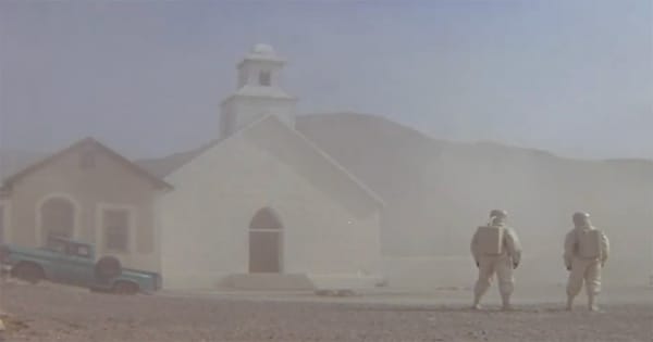 Scientists in protective suits investigate a deserted desert town after a mysterious biological event in the film "The Andromeda Strain" (1971).