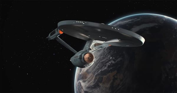 The refit USS Enterprise in orbit above a planet in Star Trek The Motion Picture, emphasizing scale, design, and the franchise’s transition from television to cinema.
