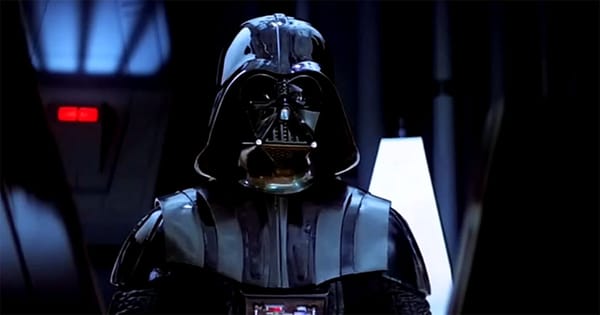 Darth Vader standing in black armor with breathing mask in Star Wars Episode IV A New Hope.