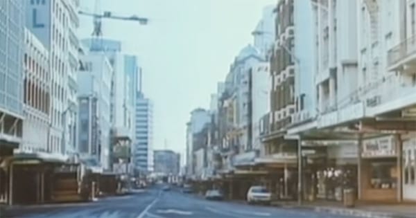 Empty city street in The Quiet Earth 1985 showing deserted downtown after humanity vanishes.