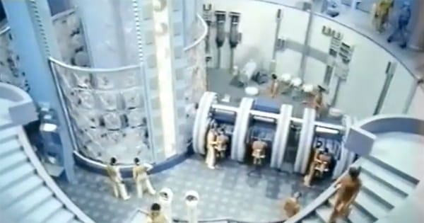 Futuristic interior of the World State facility in "Brave New World" (1980) showing controlled environment and structured society.